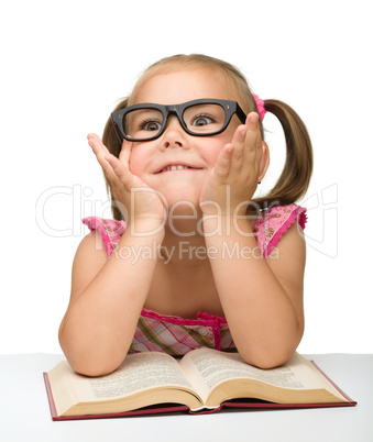 Little girl play with book