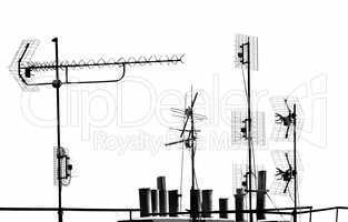 antennas and pipes on the rooftop