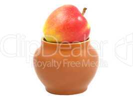 Red apple in a clay pot isolated on white background.