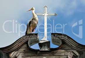 Stork and a cross