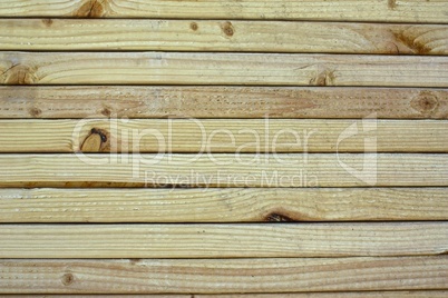 Close-up of grain on stacked lumber.