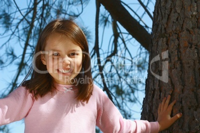 Girl climbing tree