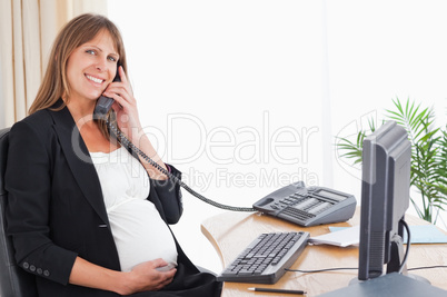Pretty pregnant woman on the phone