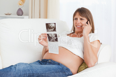 Happy pregnant woman talking about her baby's ultrasound scan