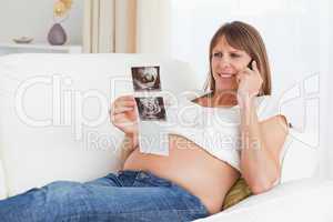 Happy pregnant woman talking about her baby's ultrasound scan