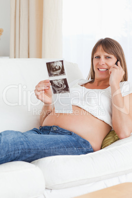 Portrait of a pregnant woman talking about her baby's ultrasound