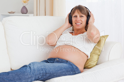 Pregnant woman listening to music