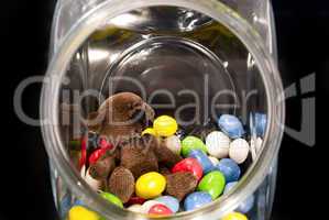 Teddy Bear  and chocolates in a glass jar