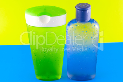 cosmetic containers on a colorful background