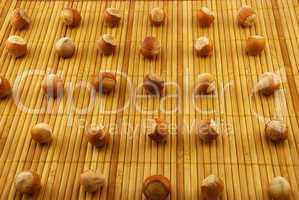 hazelnuts on a bamboo mat