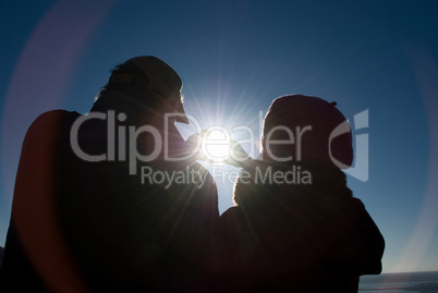 man and a woman holding a sun man and a woman holding a sun