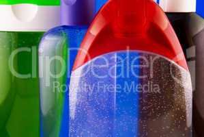 cosmetic containers on a colorful background