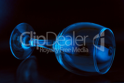 conceptually lighted wine glass on a black background