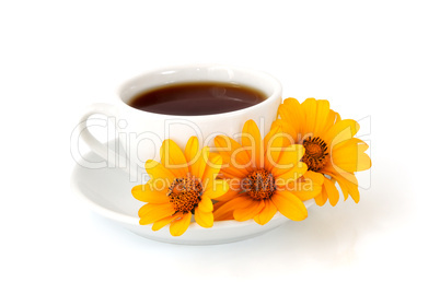 A cup of coffee with flowers