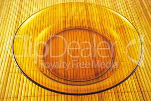 glass plate on a bamboo mat