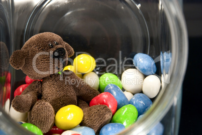 Teddy Bear  and chocolates in a glass jar