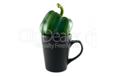 green peppers in a black cup isolated on white green peppers in a black cup isolated on white
