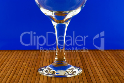 conceptually lighted wine glass on a multicolored background