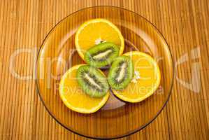 kiwi fruit and oranges on a plate