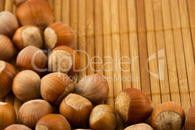 hazelnuts isolated on a bamboo mat