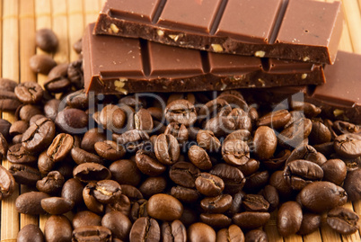 chocolate and coffee beans on a bamboo mat