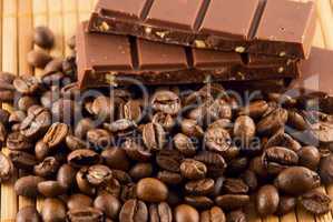chocolate and coffee beans on a bamboo mat
