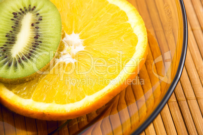 orange and kiwi fruit on a plate