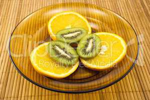 kiwi fruit and oranges on a plate