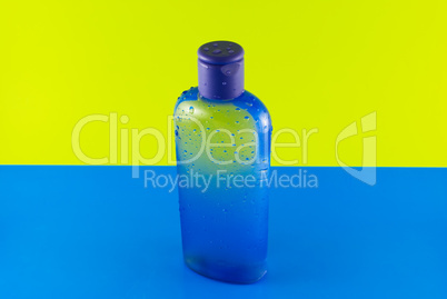 cosmetic containers on a colorful background