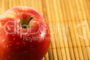 apple on a bamboo mat