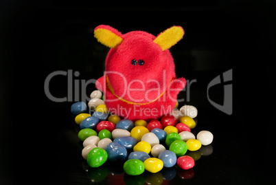 toys and sweets on a black background