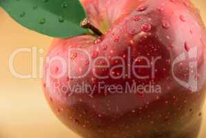 red apple on a gold background