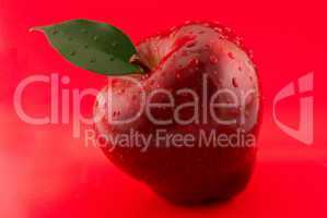 red apple on a red background