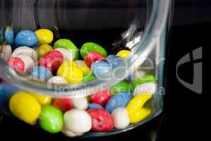 multi-colored candies in a glass jar