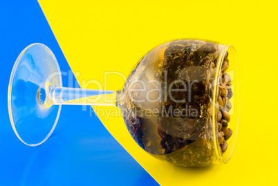 coffee beans in a glass on a colorful background