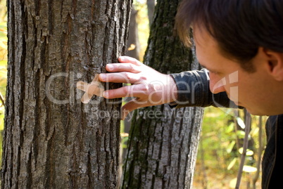 man stick plaster on wood