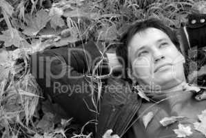 portrait of a man lying on autumn leaves