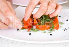 chef decorate plate with food