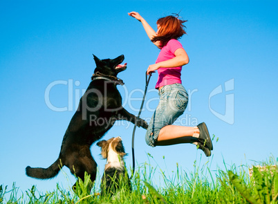 woman with her dog on meadow