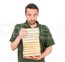 man holding stack of books