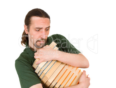 man holding stack of books