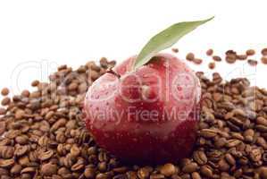 red apple and coffee beans isolated on white