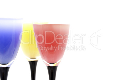 glasses with different colored drinks isolated on white