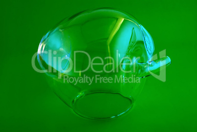glass apple on a green background