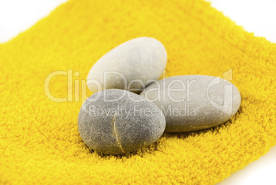 stones on the towel isolated on white