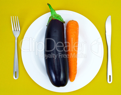 Eggplant and carrot on a white plate