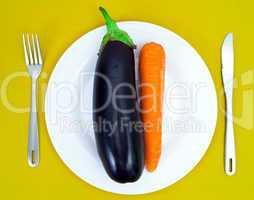 Eggplant and carrot on a white plate