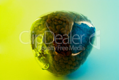 glass apple with grains of coffee