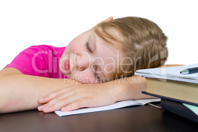 The girl has fallen asleep over textbooks