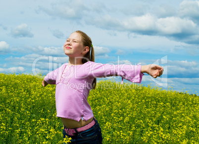 The girl on a green meadow